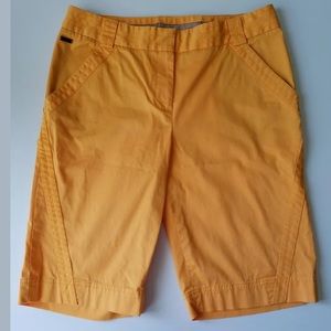 Annika Cutter and Buck Woman’s Orange Golf Shorts
